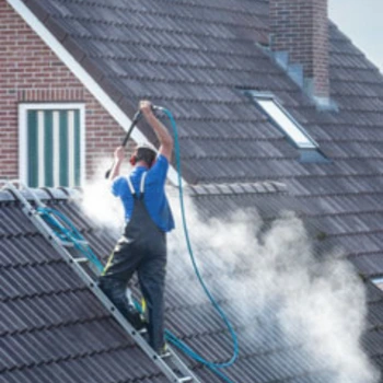 man cleaning roof with HydroBlast Power Nozzle